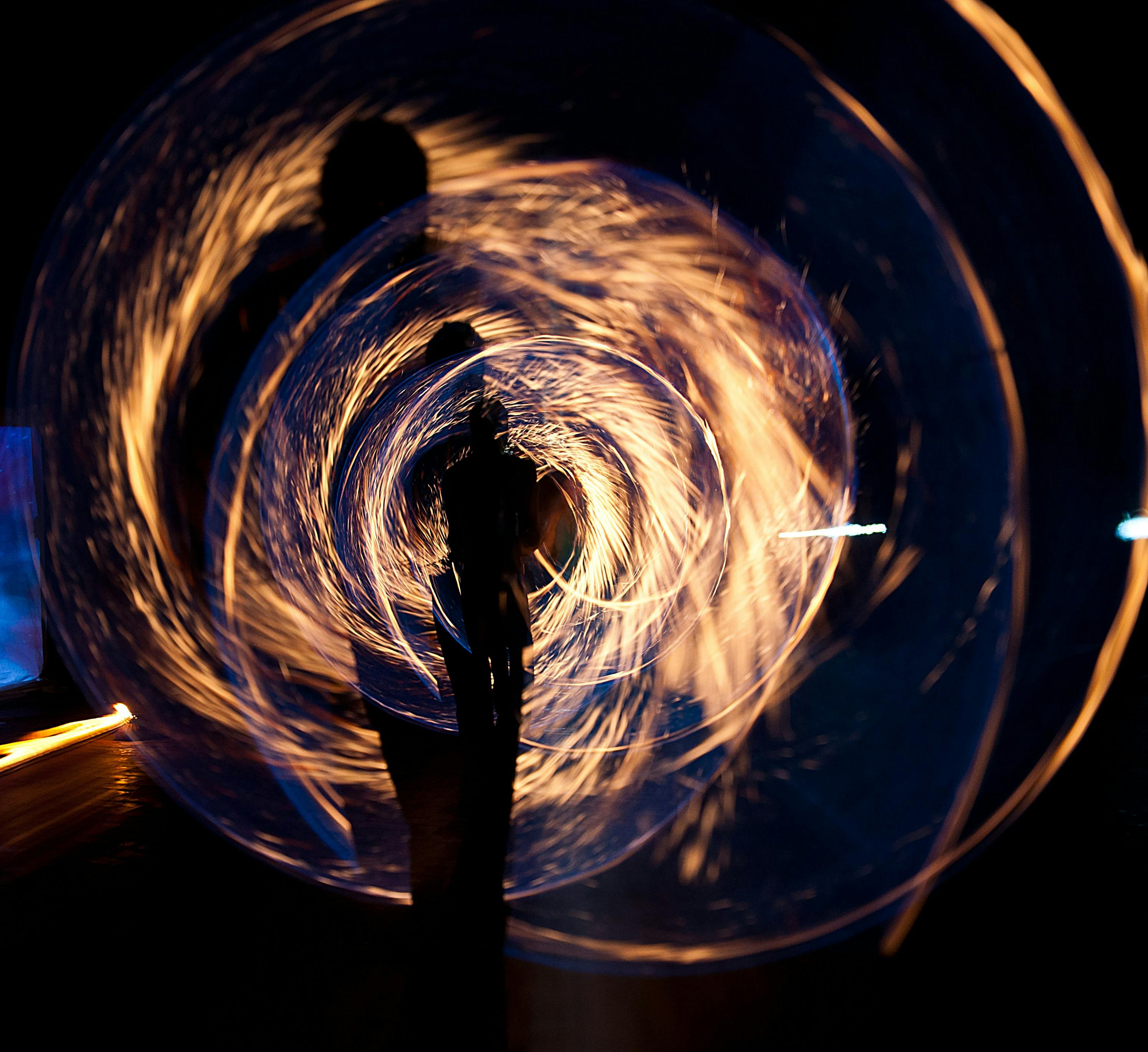 Silhouette of Person Holding Sparkler Digital Wallpaper